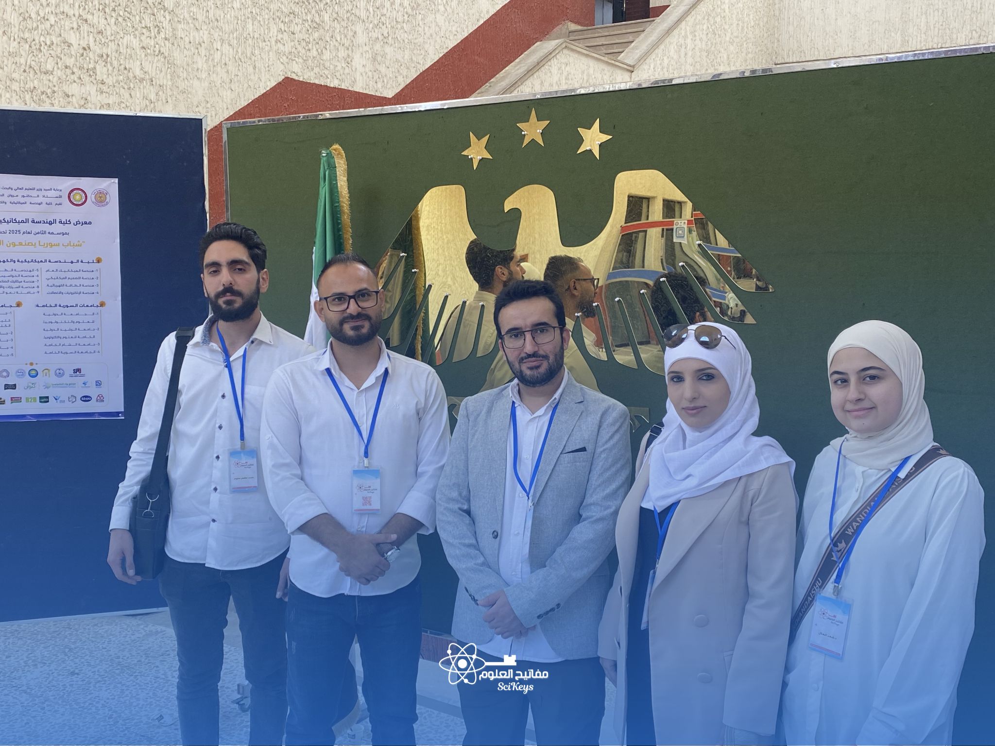 فريق جمعية مفاتيح العلوم خلال افتتاح مختبر الحاسوب في كلية الهمك بجامعة دمشق.